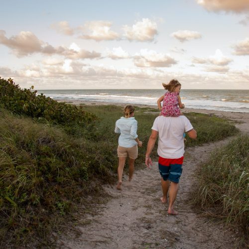 Family walking on coastal path, Blowing Rocks Preserve, Jupiter, Florida, USA